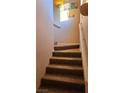 Indoor stairs with brown carpet leading to the upper level at 9975 Peace Way # 2089, Las Vegas, NV 89147