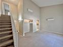 Spacious living room with high ceilings and stairs at 100 S Crestline Dr # 57, Las Vegas, NV 89107