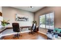 Convenient home office with built-in desk and two executive chairs at 1036 Novara Ln, Las Vegas, NV 89144