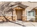 Attractive front entryway with light-brown door at 1086 Sheer Paradise Ln # 101, Henderson, NV 89002