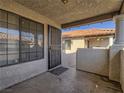 Condo entry with security door and small patio at 1409 Santa Margarita St # G, Las Vegas, NV 89146