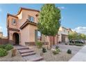 Two-story house with a two-car garage and stone accents at 1557 Mistywood Ct, Henderson, NV 89014