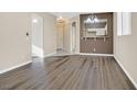 Spacious living room with hardwood floors and a view of the kitchen at 2687 Hollowvale Ln, Henderson, NV 89052