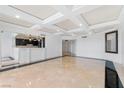 Bright living room features unique ceiling, tile floors, and modern kitchen in a spacious open layout at 2777 Paradise Rd # 303, Las Vegas, NV 89109