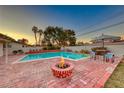 Inviting backyard oasis featuring a sparkling pool and fire pit at 2908 Bryant Ave, Las Vegas, NV 89102