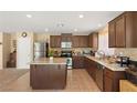 Spacious kitchen featuring an island and dark wood cabinetry at 3028 Gannon Ridge Ave, North Las Vegas, NV 89081