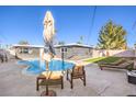 Backyard pool area with comfortable seating, offering a private outdoor space at 3809 San Angelo Ave, Las Vegas, NV 89102