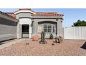 Landscaped front yard with a fountain and cacti at 4210 Night Star St, Las Vegas, NV 89147