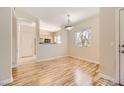 Dining area with hardwood floors and adjacent kitchen at 5250 S Rainbow Blvd # 2056, Las Vegas, NV 89118