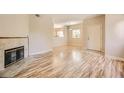 Light and airy living room featuring hardwood floors and a fireplace at 5250 S Rainbow Blvd # 2056, Las Vegas, NV 89118