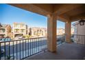 This home's private balcony is overlooking the neighborhood street at 5391 Kennedy Hill Ave, Las Vegas, NV 89139