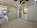 View of the Bedroom with updated flooring and bathroom with sink at 619 Brush St, Las Vegas, NV 89107