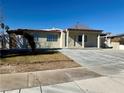 Charming single story home with large front windows and covered entry way at 619 Brush St, Las Vegas, NV 89107