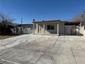 Charming single story home with large front windows and covered entry way at 619 Brush St, Las Vegas, NV 89107