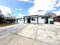 Single-story home with a long concrete driveway, and a well-maintained exterior at 619 Brush St, Las Vegas, NV 89107