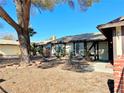 House exterior showcasing a front entrance and mature tree at 6402 Agua Dr, Las Vegas, NV 89103