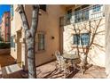 Small patio with table and chairs, surrounded by trees at 7453 Vital Ct, Las Vegas, NV 89149