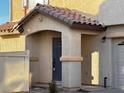 House entrance with covered porch and dark gray door at 938 Cantabria Heights Ave, Las Vegas, NV 89183