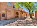 Covered patio and spacious backyard with gravel landscaping at 10161 Kermode Ct, Las Vegas, NV 89178