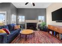 Spacious living room featuring a fireplace and plenty of natural light at 1715 Mesquite Ct, Henderson, NV 89014