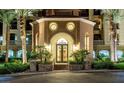 Elegant building entrance with ornate doors and landscaping at 20 Via Mantova # 309, Henderson, NV 89011