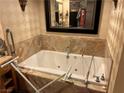 Bathroom with large bathtub and marble tile at 2000 N Fashion Show Dr # 1704, Las Vegas, NV 89109