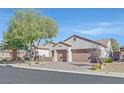 Two-story house with attached garage and mature trees at 2050 Cambridge Springs Dr, Henderson, NV 89052