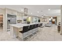 Spacious kitchen featuring an island, stainless steel appliances, and breakfast bar at 2130 Maderno St, Henderson, NV 89044