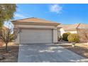 Single-story home with attached garage and desert landscaping at 2255 Potter Lake Ave, Henderson, NV 89052