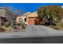 Single-story home with a two-car garage and mature trees at 2694 Kinghorn Pl, Henderson, NV 89044