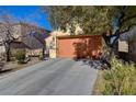 Single-story home with a two-car garage and drought-tolerant landscaping at 2694 Kinghorn Pl, Henderson, NV 89044