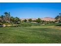 Landscaped golf course with lake and mountain views at 272 Arbour Garden Ave, Las Vegas, NV 89148