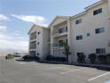 Condo building with parking area and desert landscape at 3550 Bay Sands Dr # 3073, Laughlin, NV 89029