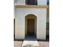 Inviting entryway with a brown door and stone address marker at 50 Aura De Blanco St # 13103, Henderson, NV 89074