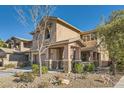 Two-story house with stone accents and landscaping at 5442 Bristol Bend Ct, Las Vegas, NV 89135