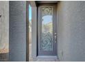 Inviting front door entrance with glass accents and a welcome mat at 6201 Ashley Hills Ave, Las Vegas, NV 89141