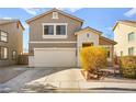 Two-story house with attached garage and landscaping at 6227 Legend Falls St, North Las Vegas, NV 89081