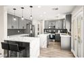 Modern kitchen with gray cabinets and white marble countertops at 6227 Legend Falls St, North Las Vegas, NV 89081