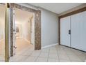 Bright entryway with tile flooring, granite accents, and double doors at 6725 Carrera Dr, Las Vegas, NV 89103