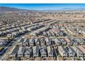 Aerial view of a community with many houses and mountain views at 707 Cottonwood Hill Pl, Henderson, NV 89011