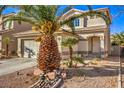 Two-story house with attached garage and palm trees at 7163 Brassica Ct, Las Vegas, NV 89148