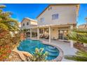 Inviting kidney-shaped pool with covered patio at 7163 Brassica Ct, Las Vegas, NV 89148