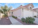 Well-maintained home with walkway, two-car garage, and drought-tolerant landscaping at 7925 Settlers Ridge Ln, Las Vegas, NV 89145