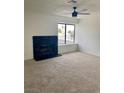 Spacious living room featuring a fireplace and large window at 8101 Spur Ct, Las Vegas, NV 89145