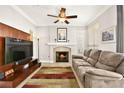 Gathering room featuring a fireplace and built-in shelving at 9700 Port Orange Ln, Las Vegas, NV 89134