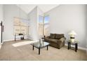 Bright living room with tiled floors and large windows at 9700 Port Orange Ln, Las Vegas, NV 89134