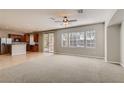 Open living room and kitchen area with large windows at 9802 Twin Mill St, Las Vegas, NV 89178