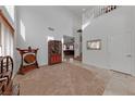 Bright and spacious entryway with high ceilings and hardwood floors at 10350 Blue Ginger Dr, Las Vegas, NV 89135