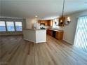Spacious kitchen with wood cabinets and a breakfast bar at 11660 Fiorello Ct, Las Vegas, NV 89183