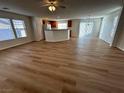 Open living area with light flooring and a view of the kitchen at 11660 Fiorello Ct, Las Vegas, NV 89183